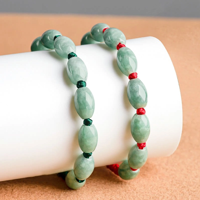 Jade luck red string bracelet detail shot of braided cord texture