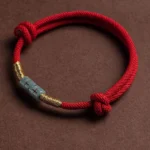 Red Jade String Bracelet with Gold Accents - Flat Lay Top View