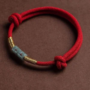 Red Jade String Bracelet with Gold Accents - Flat Lay Top View