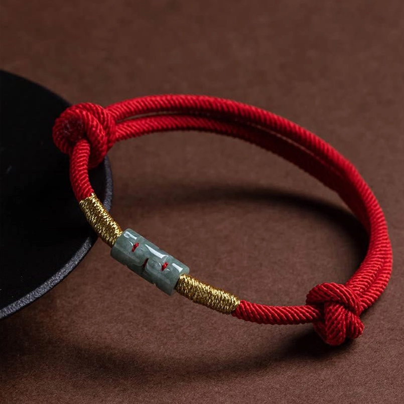 Red Jade Rope Bracelet with Gold Twist Detail - Angled View