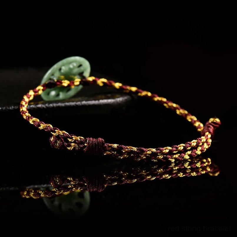 Natural jade abundance bracelet low angle view on dark display stand
