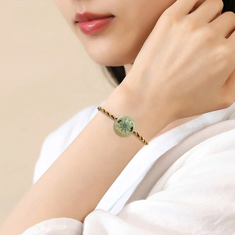 Model wearing jade sun braided bracelet on wrist lifestyle shot