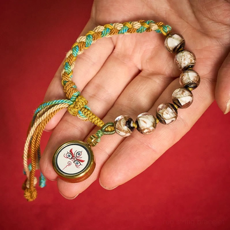 Tibetan Buddha eye Jambhala bracelet front view on display stand