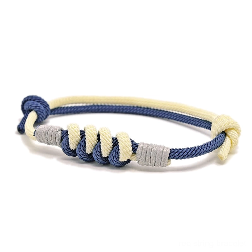 Dark blue Tibetan King Kong knot protection bracelet, angled top view showing sacred knot