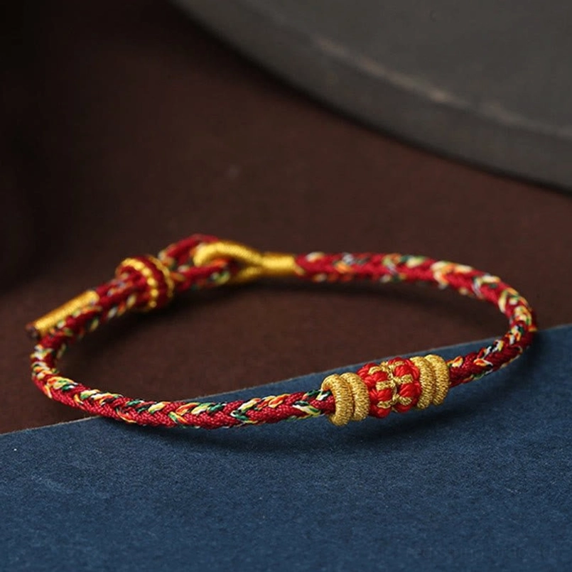 Multiple angles of handmade King Kong Knot Tibetan bracelet showing adjustable toggle closure design
