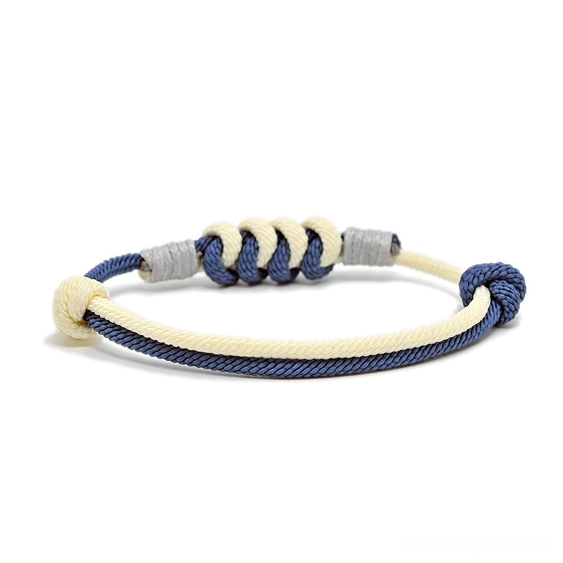Navy blue King Kong knot spiritual bracelet, detailed view of handmade braided cord and copper fasteners