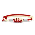 Red and white King Kong knot braided string bracelet with copper fasteners, flat lay top view