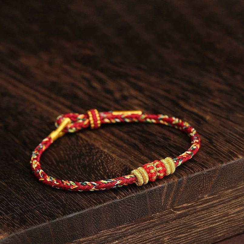 Side view of King Kong Knot Tibetan lucky bracelet with adjustable gold knot closure