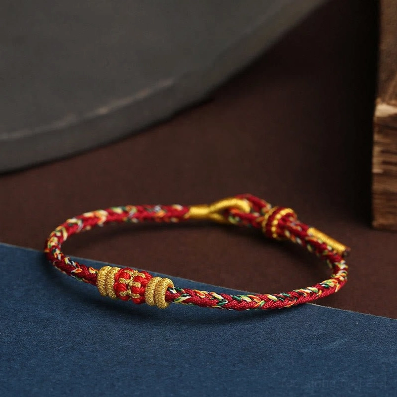 King Kong Knot Tibetan protection bracelet red braid with clustered gold knots detail shot