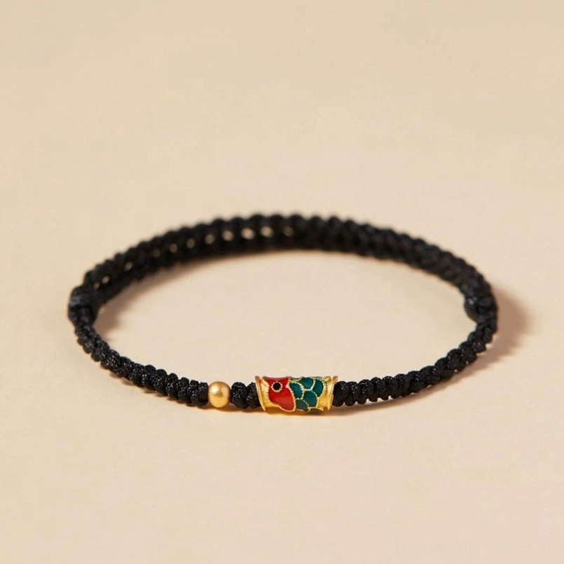 Black koi fish bracelet with golden bead accent and enamel charm for wealth and protection