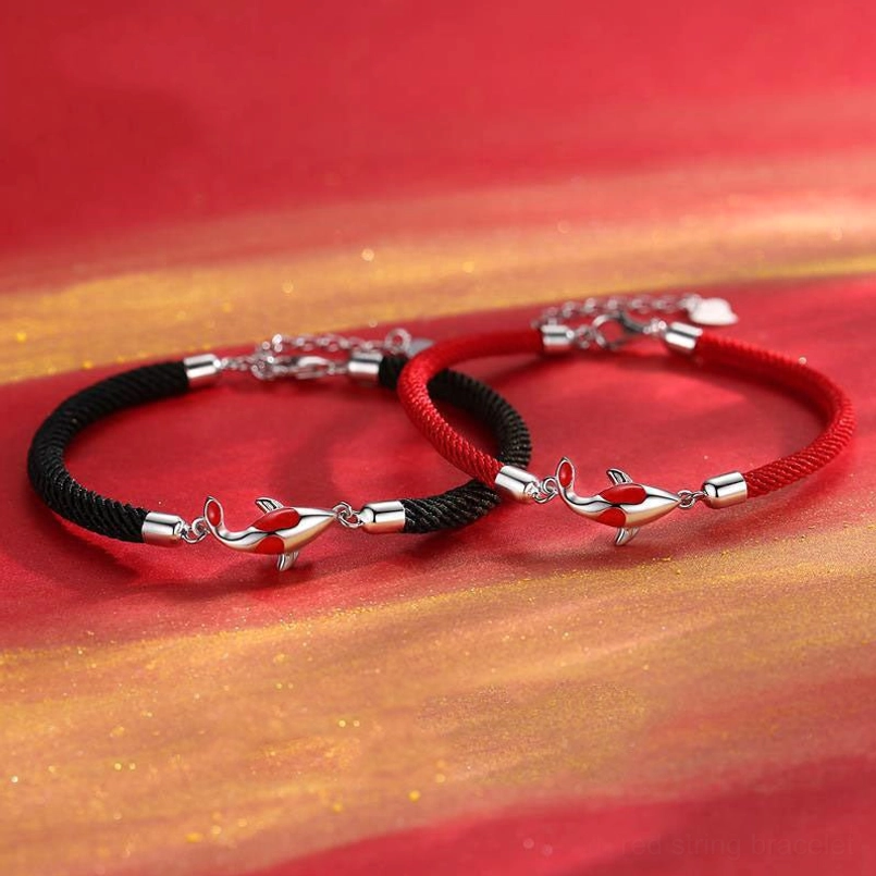 Two pairs of koi fish couple bracelets in red and black rope with silver-toned enamel charms