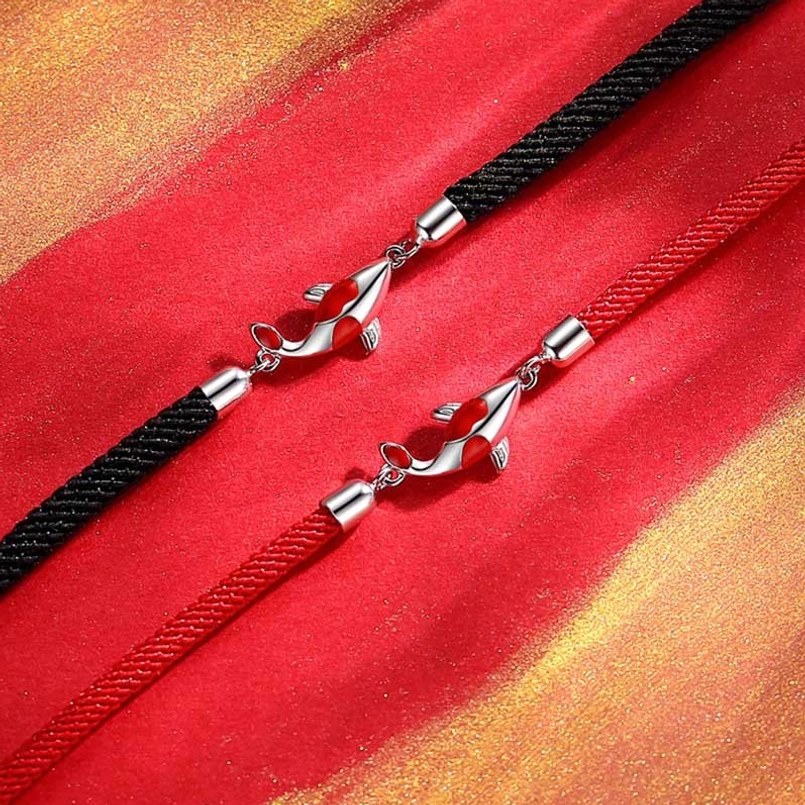 Close-up detail of koi fish bracelet showing woven rope texture and metal hardware
