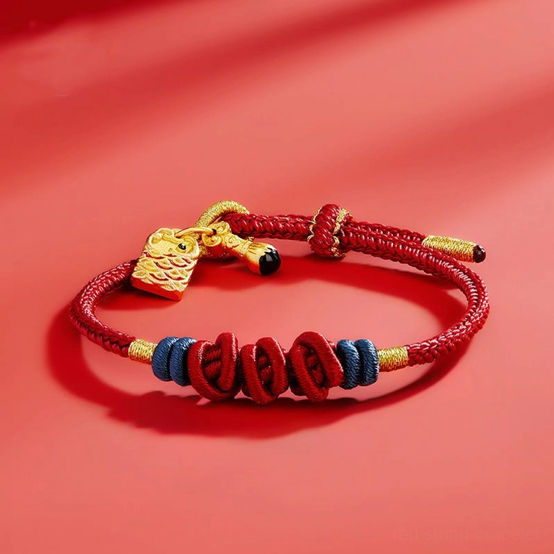 Handmade red string koi fish bracelet with blue-gold decorative knots side angle
