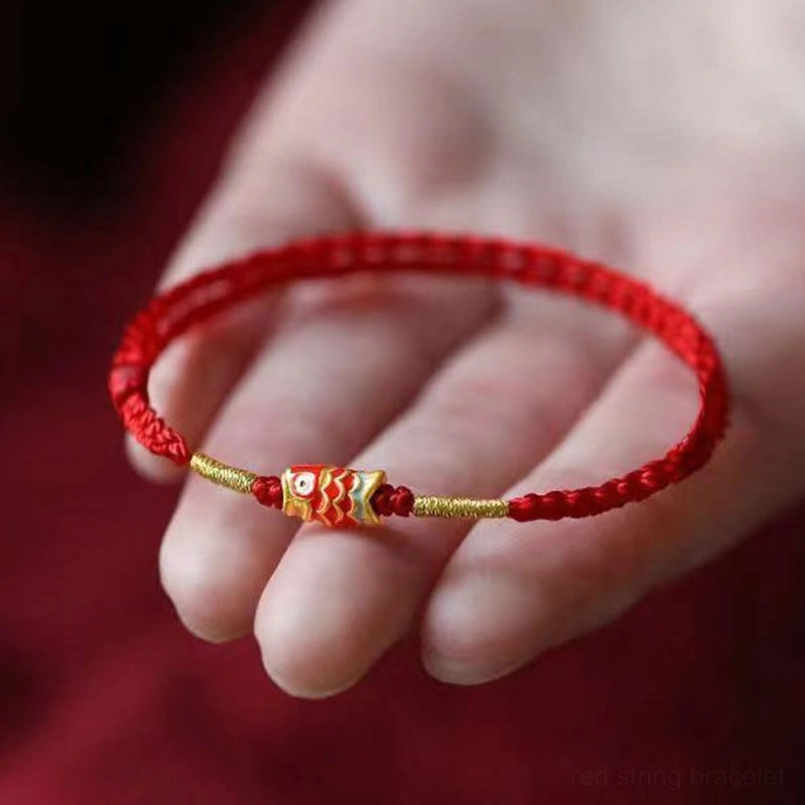 Koi Fish Red String Bracelet Worn on Hand Close Up View