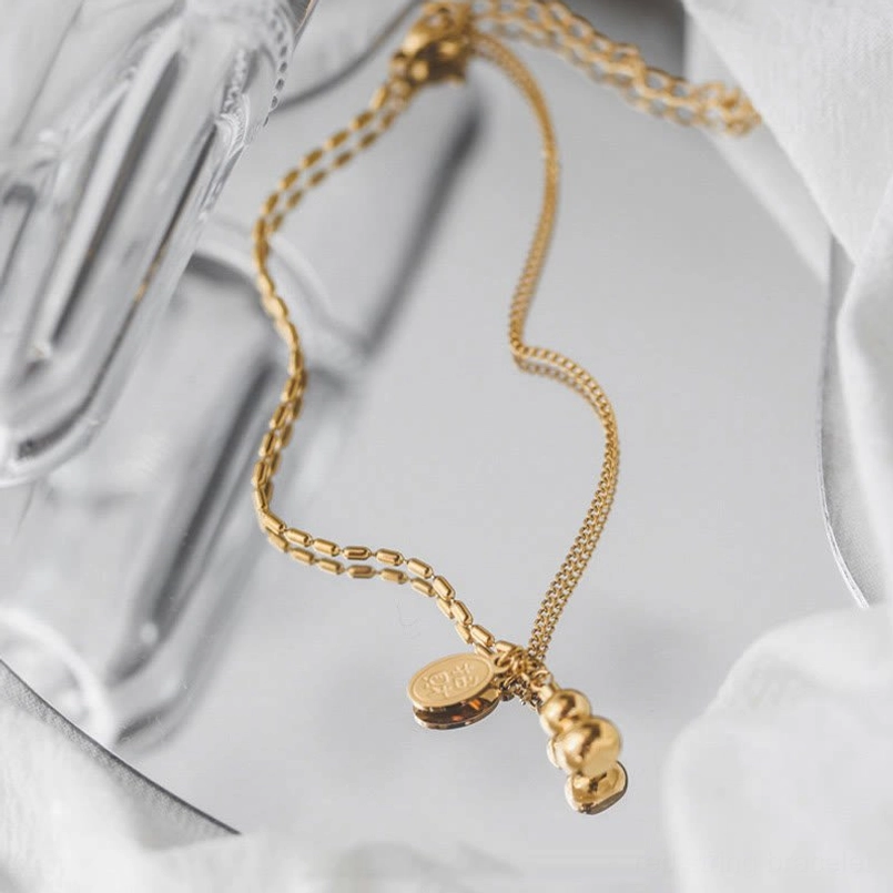 Twisted chain segments with textured lucky gourd and prosperity tag charms