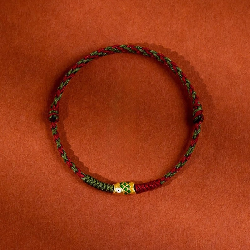 Handcrafted koi fish lucky charm bracelet with woven red green rope