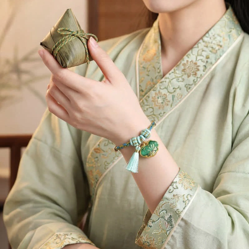 Chinese protection bracelet with braided five-color cord money bag enamel charm and turquoise tassel fortune amulet