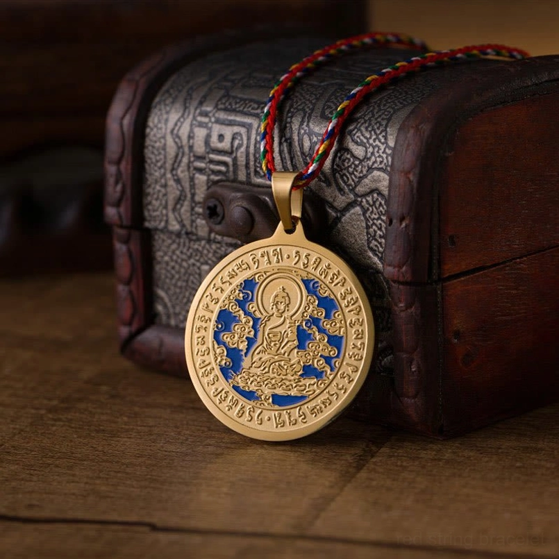 Bhaisajyaguru Medicine Buddha mantra necklace gold finish with sacred sutra engravings and colorful rope side view