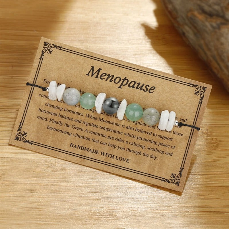 Handmade menopause healing bracelet with natural stone beads and instruction card flat lay