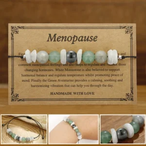 Menopause healing bracelet with white moonstone labradorite aventurine and vintage greeting card on wooden surface