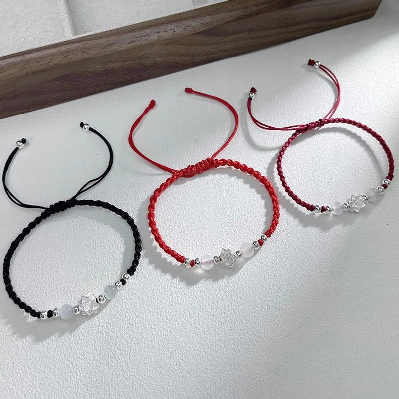 minimalist handwoven red string protection bracelets top view
