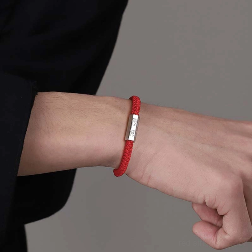 Minimalist woven red string bracelet with 925 silver charm side wrist view