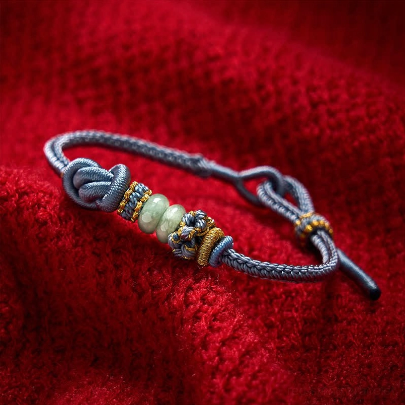 Mist blue adjustable jade bracelet with golden knots lifestyle shot