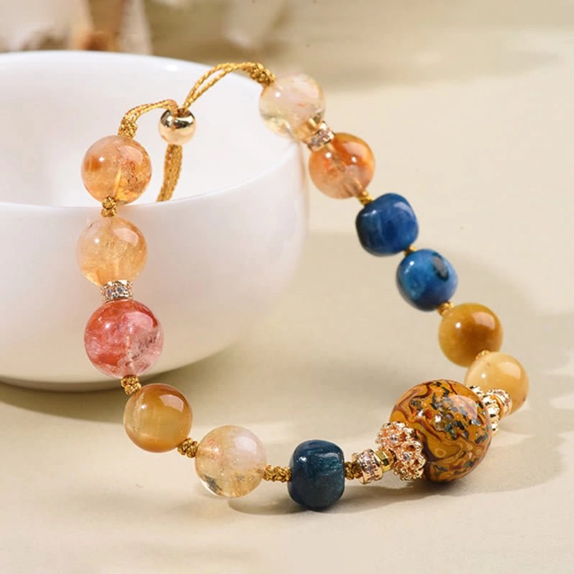 Full detail view of mixed color lacquer and crystal beads with gold adjustable hardware