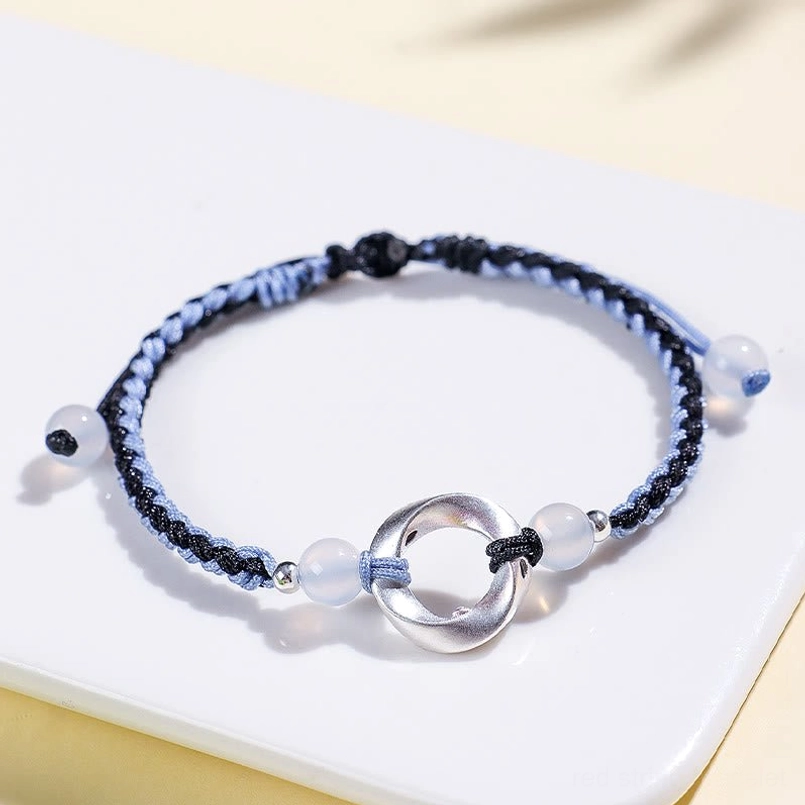 Blue-black braided red string bracelet with white agate bead and sterling silver accents, premium craftsmanship