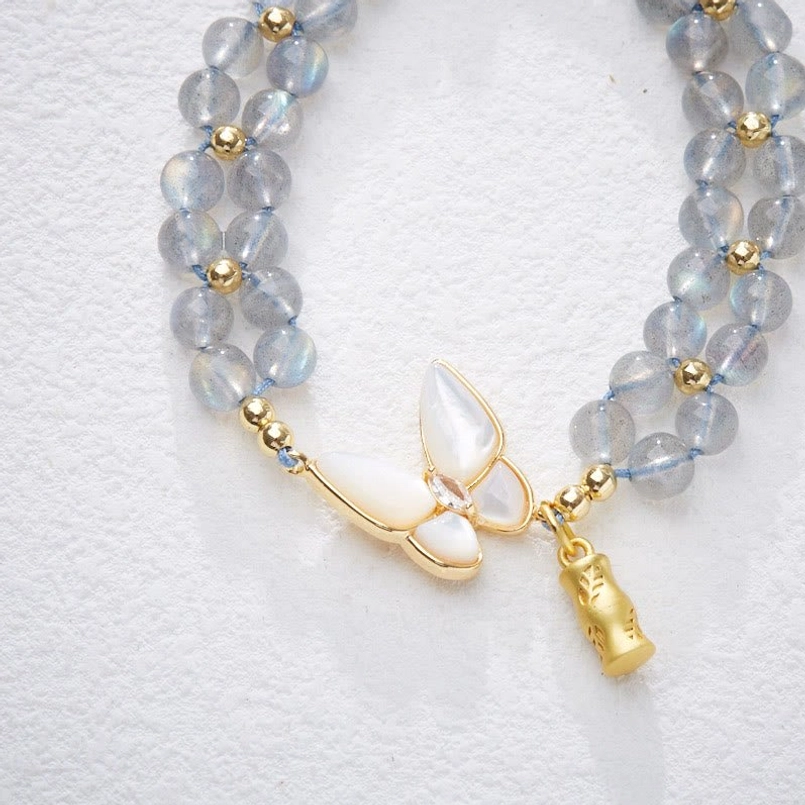 Close Up View of Moonstone Beads Butterfly and Bamboo Charms Bracelet
