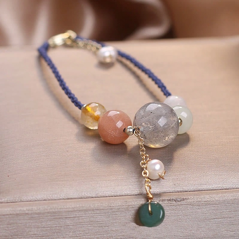 Red string moonstone peace buckle bracelet gift presentation luxury packaging