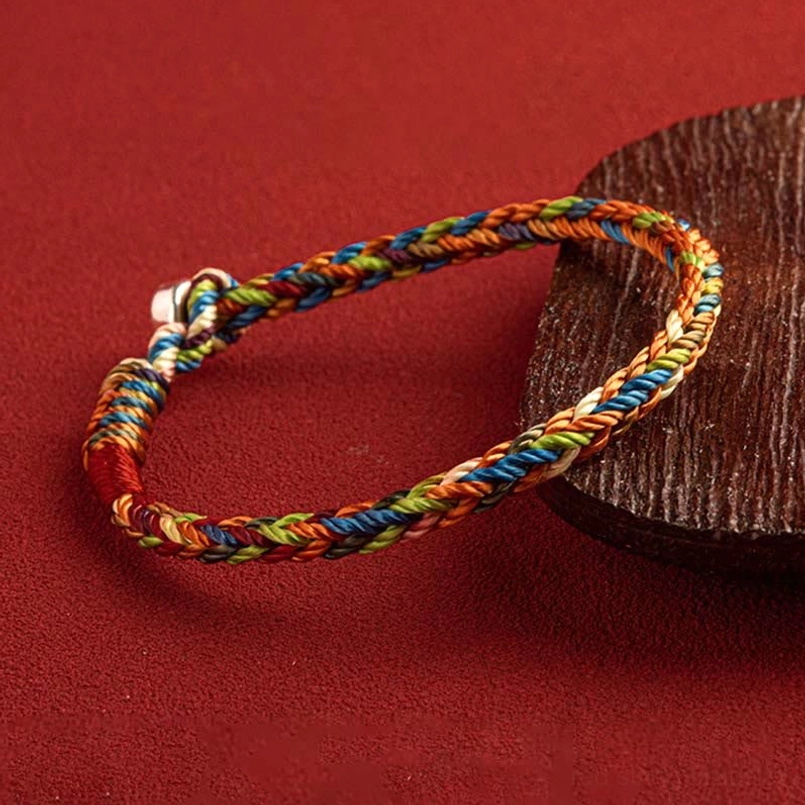 Handcrafted multicolor braided rope bracelet with twisted threads and silver metal clasp detail