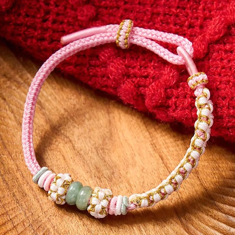 Multicolor Chinese knot bracelet combining multiple cord colors with jade
