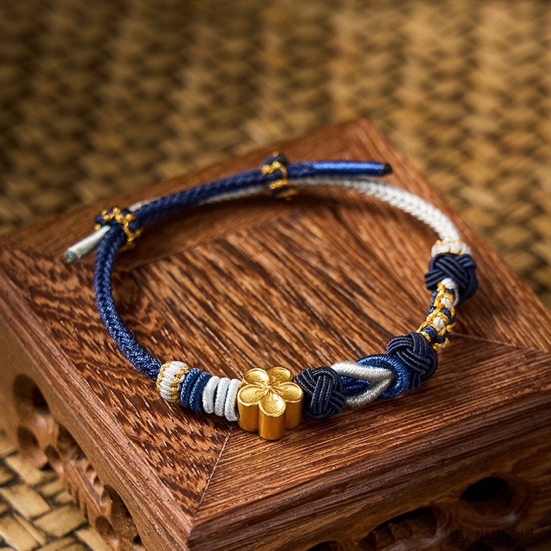 Multicolor hand-woven Chinese knot bracelet featuring intricate cord work and metal accents