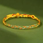 Multicolor hand-woven red string braided bracelet with adjustable toggle closure, featuring mixed blue, white, red, and green fibers in traditional Tibetan Buddhist style