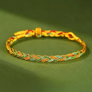 Multicolor hand-woven red string braided bracelet with adjustable toggle closure, featuring mixed blue, white, red, and green fibers in traditional Tibetan Buddhist style