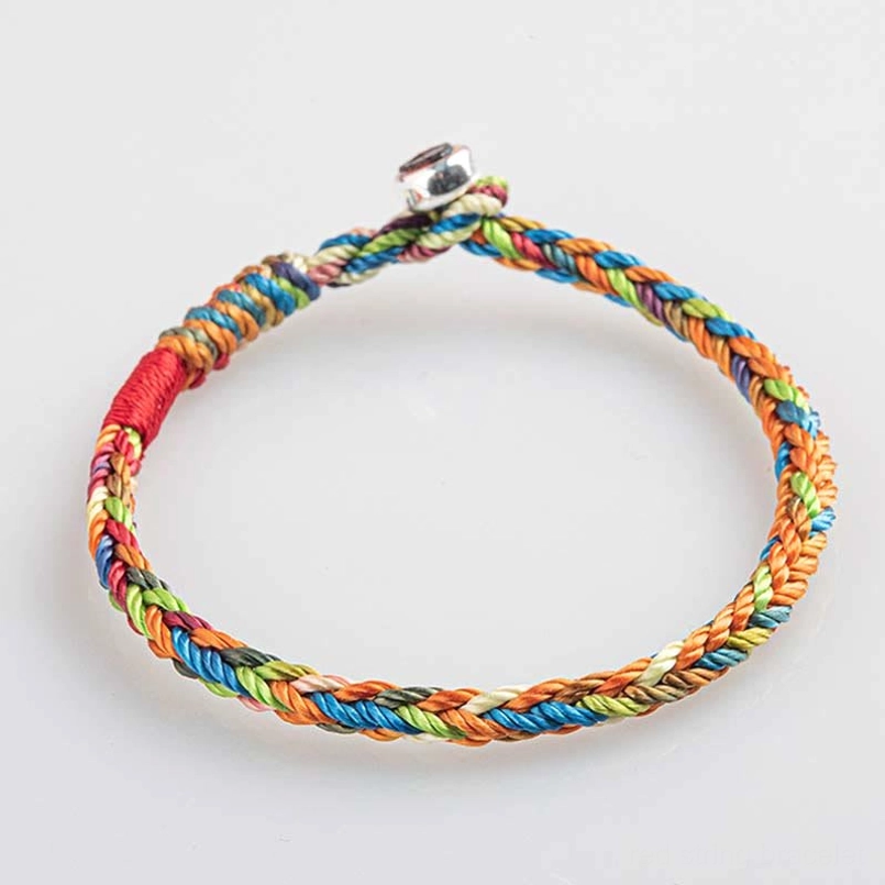 Circular woven multicolor red string bracelet with vibrant threads and silver fastener