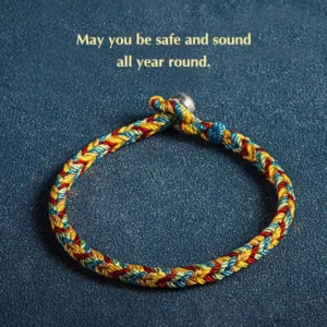 Multicolor red string bracelet with eight-thread design and silver King Kong knot charm on deep blue background with blessing text