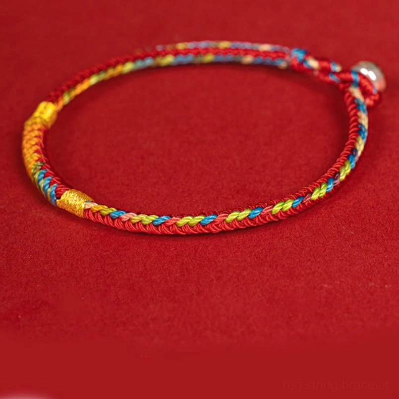 Multicolor red string bracelet side view showing woven texture and silver buckle