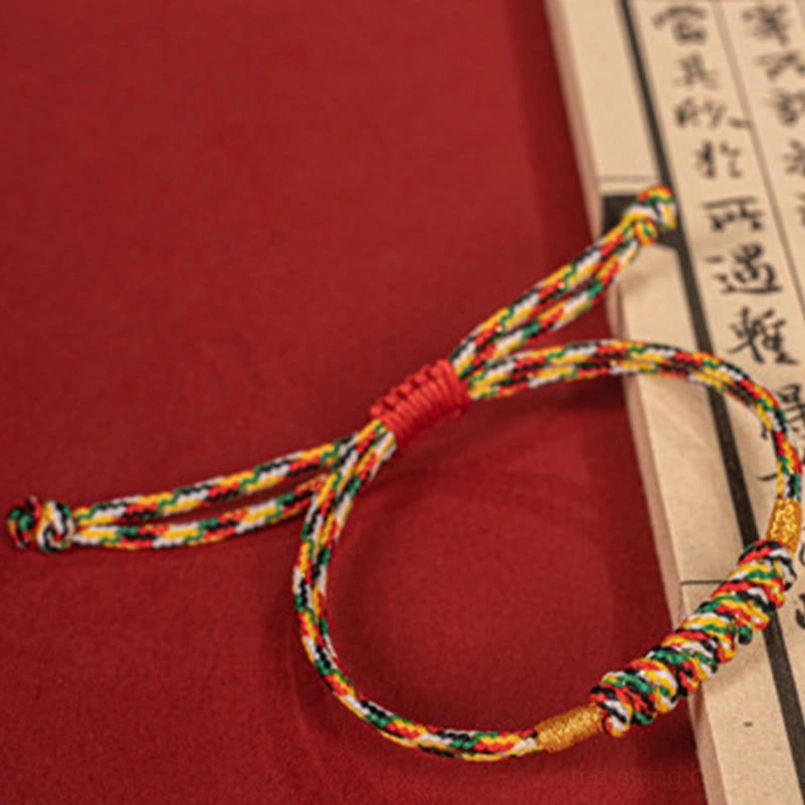 Multicolor red string bracelet worn on wrist daily casual wear display