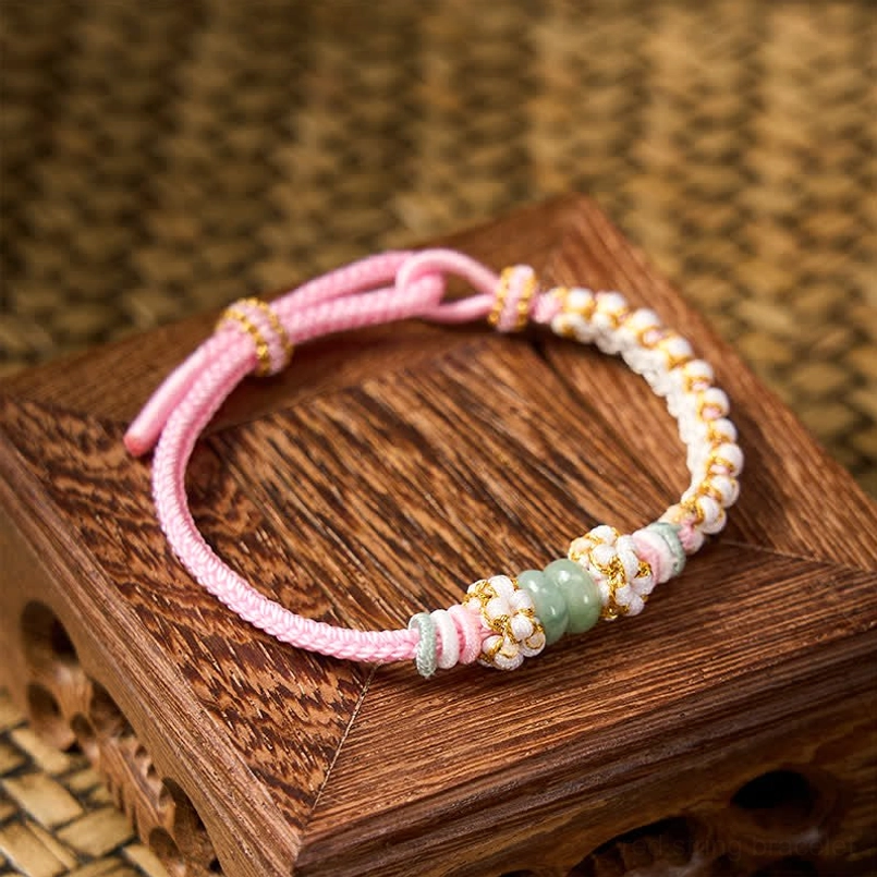 Multicolor string bracelet with mixed cord tones and jade beads display