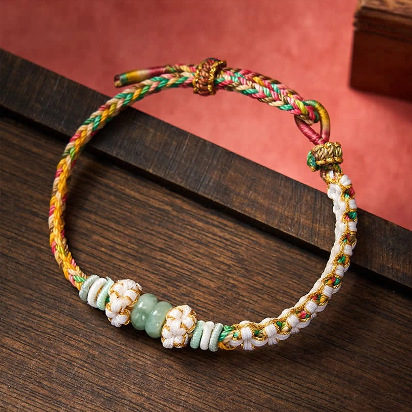 Multicolor Chinese knot bracelet with mixed cord colors and jade styling