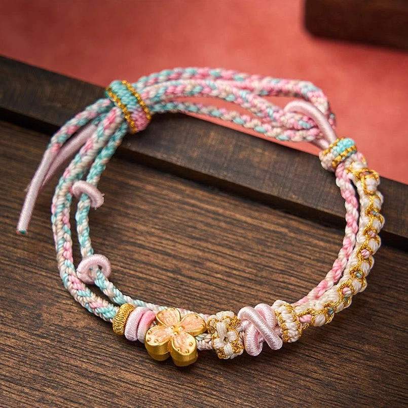 Multicolor peach blossom woven bracelet with decorative knots and gold pendant