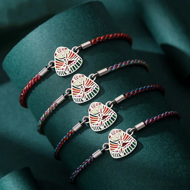 Set of multicolor zongzi charm sterling silver red string bracelets close up view