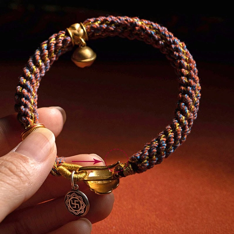 Natal Buddha Bracelet Close-up - Om Mani Padme Hum Tag and Bell Charm