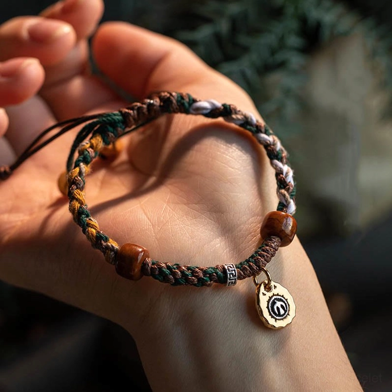 Close up of natural bone bead detail on Tibetan red string bracelet