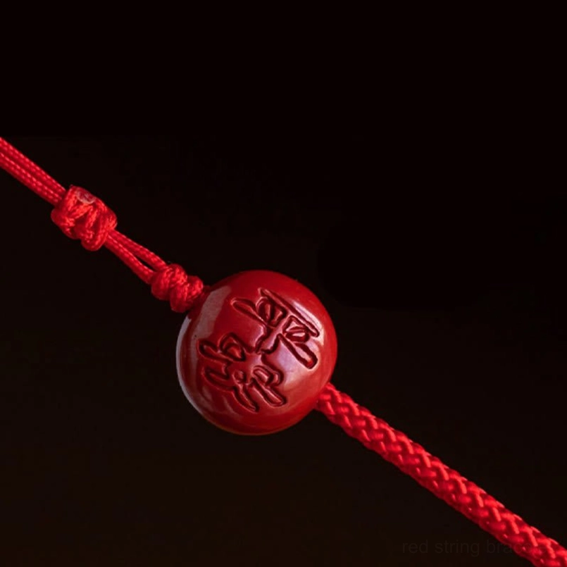 Natural cinnabar red string belly chain showing deep red stone color and braided cord detail