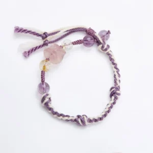 Fluorite amethyst red string bracelet flat lay on white background