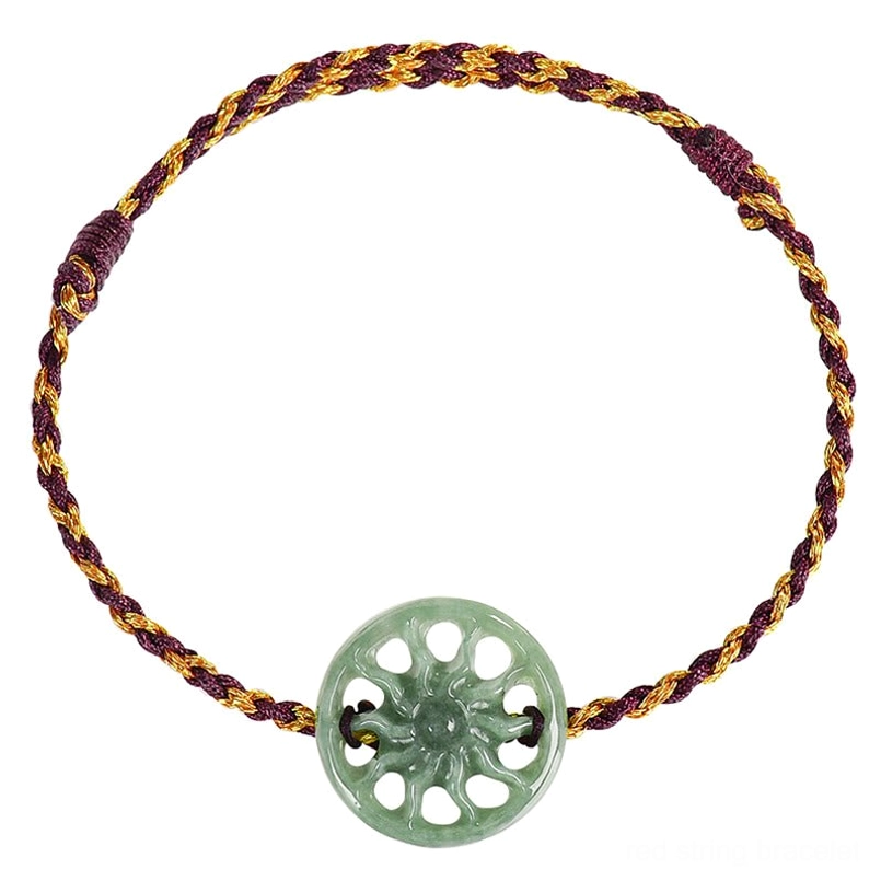 Close up view of carved natural green jade sun charm bracelet