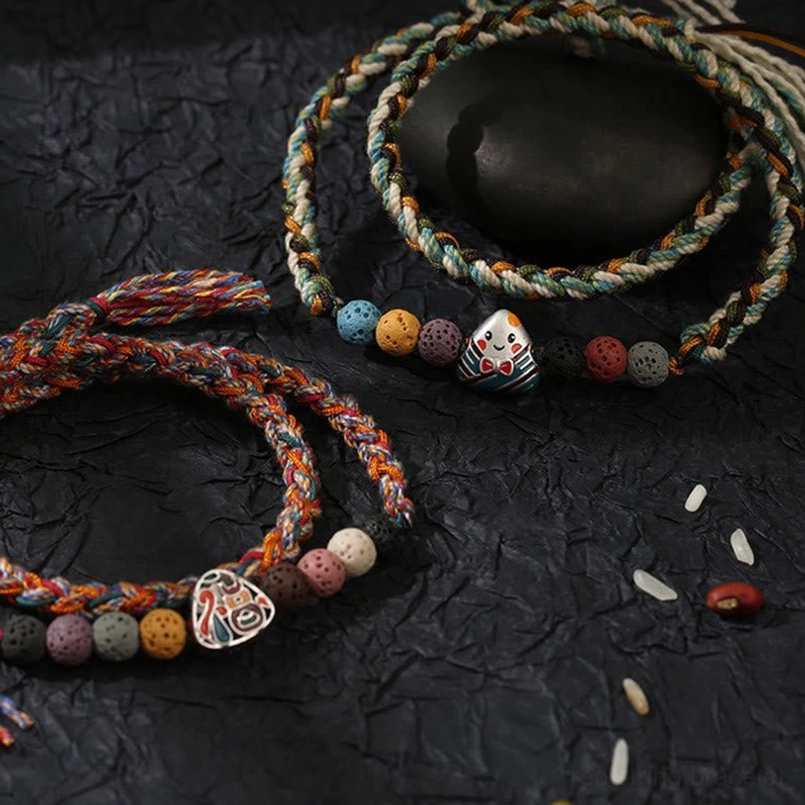 Natural lava rock bead close up on lucky braided bracelet